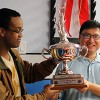 Blen and David holding trophy