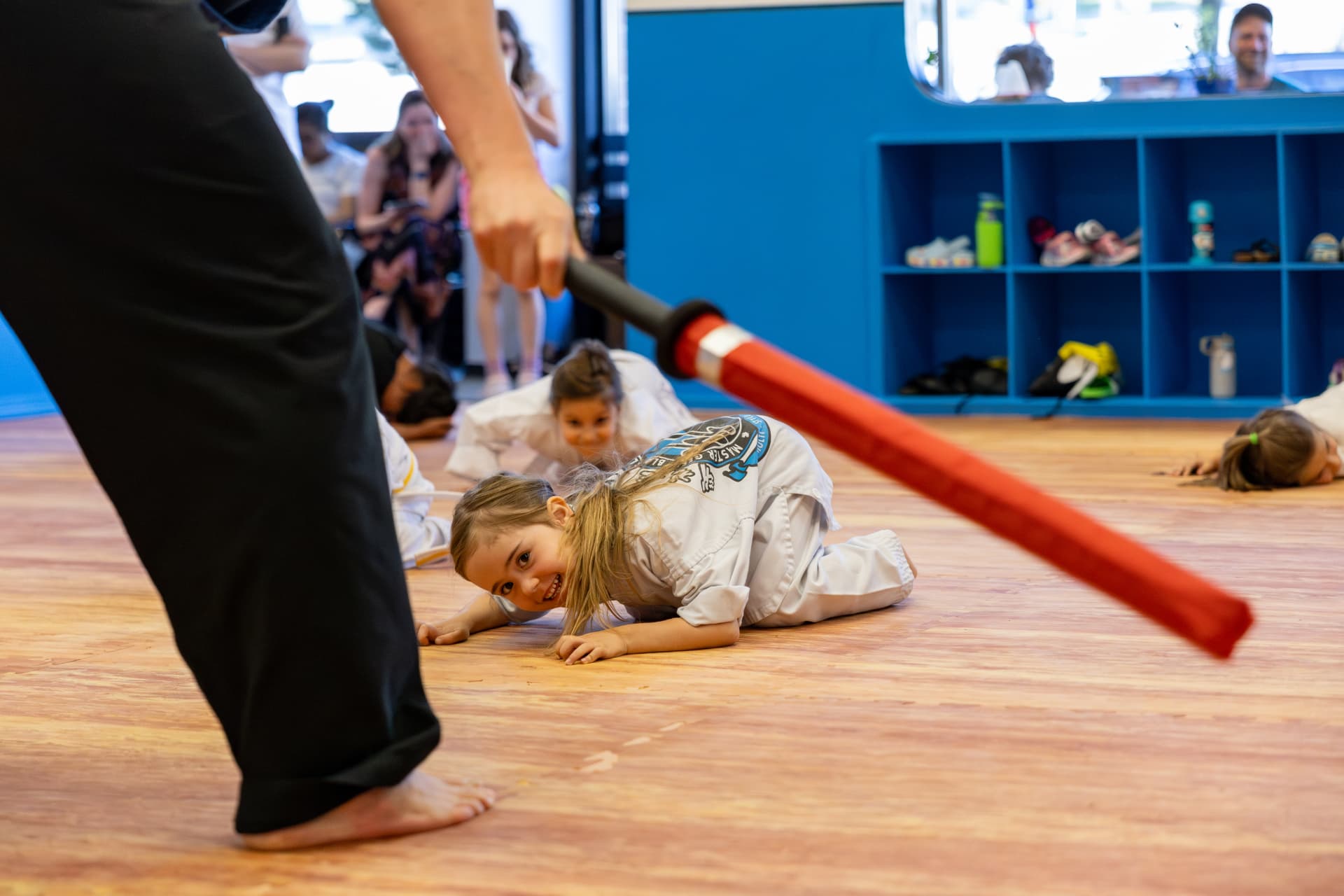 Young student smiling during a duck-and-roll drill
