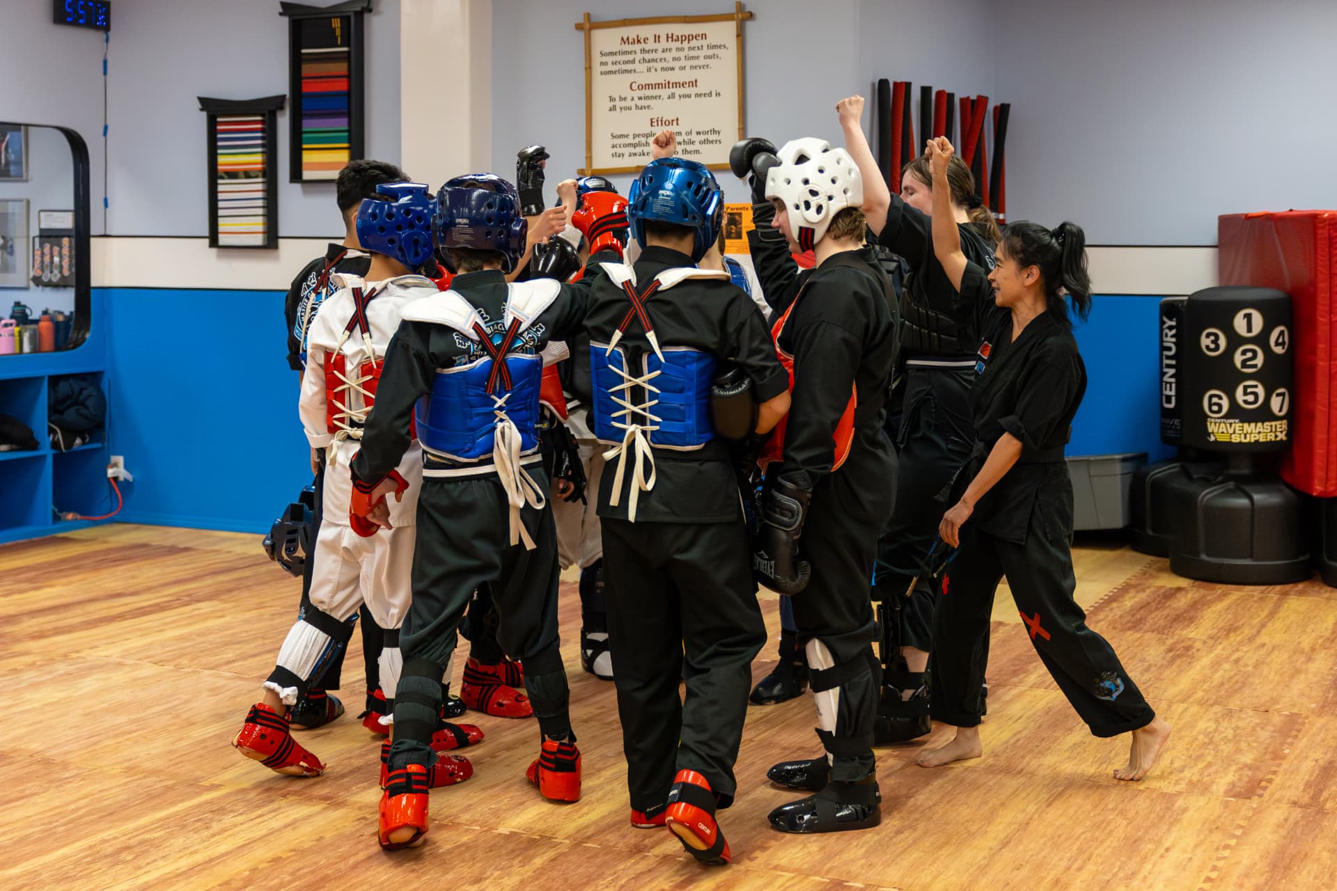 Sparring class huddling together after drills